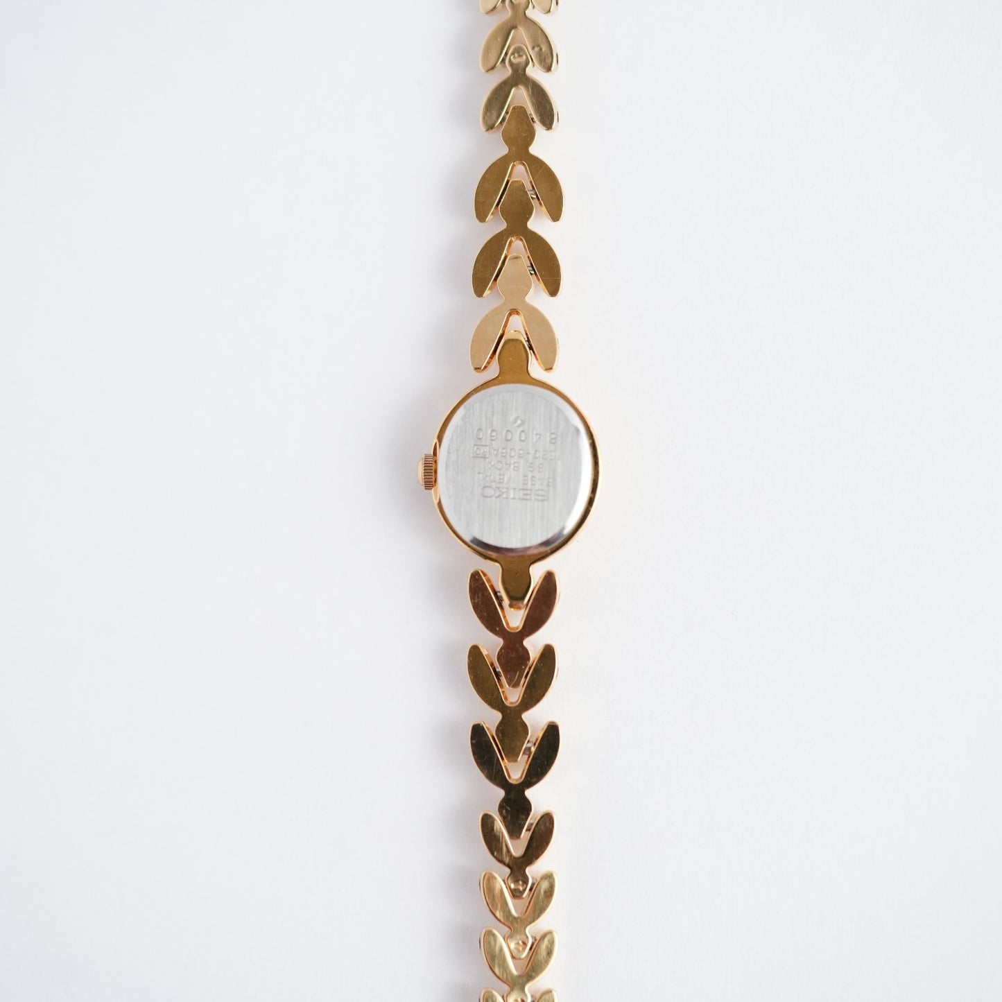 Seiko Ladies Ruby Bracelet 1E20-605A Gold Tone Watch